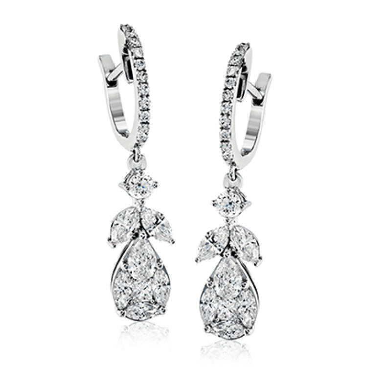 These lovely 18k white gold earrings contain .75 ctw of marquise diamonds, .30 ctw of pear shaped diamonds, .13 ctw of princess cut diamonds, and .30 ctw of round brilliant diamonds.
