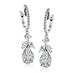These lovely 18k white gold earrings contain .75 ctw of marquise diamonds, .30 ctw of pear shaped diamonds, .13 ctw of princess cut diamonds, and .30 ctw of round brilliant diamonds.