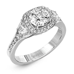 Featuring a lovely contemporary design, this white gold ring is complemented by a halo of .28 ctw round cut white diamonds and accented with .44 ctw moon shaped diamonds.