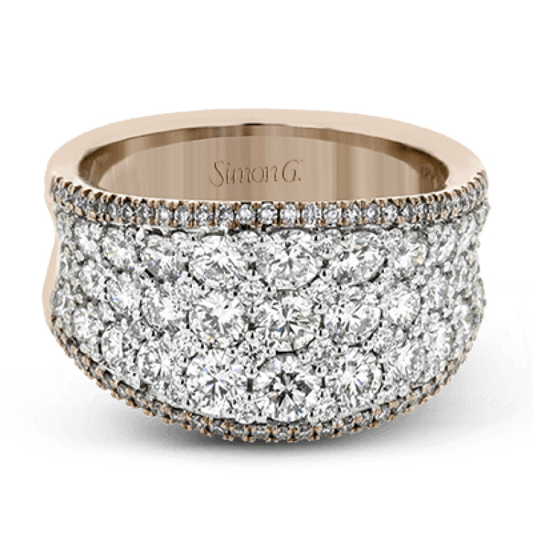 This bold statement ring is made from 18k rose and white gold and contains 2.01 ctw of white round brilliant diamonds as well as .23 ctw of pink diamonds.