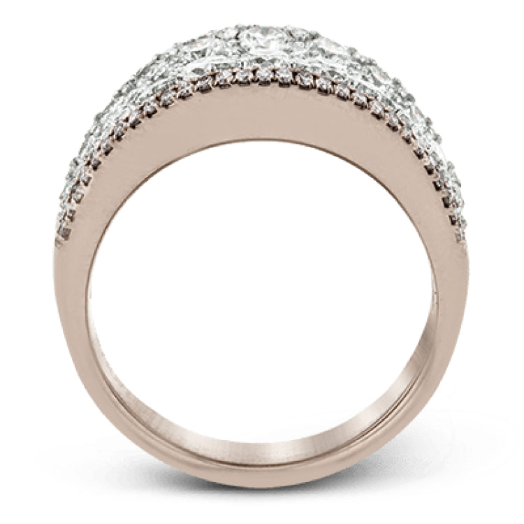 This bold statement ring is made from 18k rose and white gold and contains 2.01 ctw of white round brilliant diamonds as well as .23 ctw of pink diamonds.
