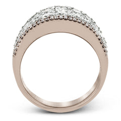 This bold statement ring is made from 18k rose and white gold and contains 2.01 ctw of white round brilliant diamonds as well as .23 ctw of pink diamonds.