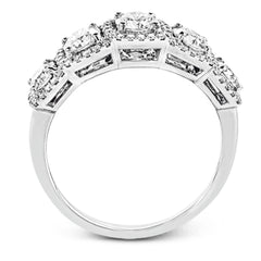 This eye-catching white gold modern band features multiple exquisite halos set with 1.33 ctw glistening round cut white diamond accents.