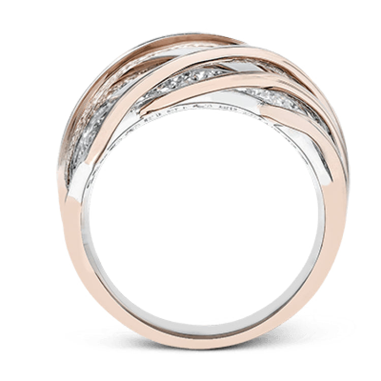 This unique two-toned ring design contains 1.40 ctw of white diamonds pave set in to 18k white gold, overlaid by organic bands of 18k rose gold.