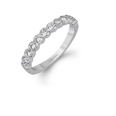 This engagement and wedding band set combines old and new with 1.09 ctw of round brilliant diamonds bezel set into 18k white gold, accented with vintage-inspired milgrain.