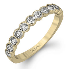 This engagement and wedding band set combines old and new with 1.09 ctw of round brilliant diamonds bezel set into 18k white gold, accented with vintage-inspired milgrain.