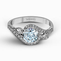 The charming floral design of this contemporary white gold ring is enhanced by .28 ctw of round cut white diamonds and .07 ctw of marquise cut white diamonds.