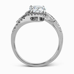 The charming floral design of this contemporary white gold ring is enhanced by .28 ctw of round cut white diamonds and .07 ctw of marquise cut white diamonds.