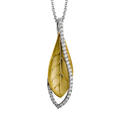 A modern leaf design pendant in 18K yellow gold suspended in a line of white diamonds 0.32 ctw, 19 adjustable chain