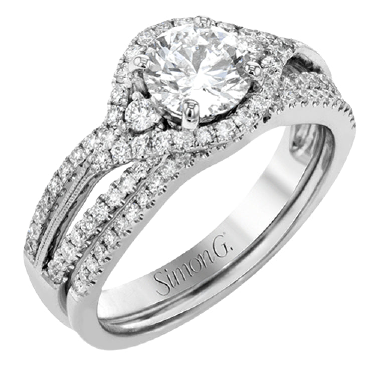 Featuring a modern design, this rose and white gold engagement ring and wedding band is highlighted by .51 ctw of round cut white diamonds.