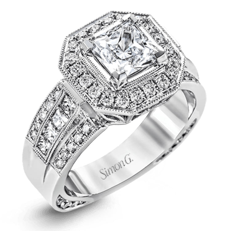 The dramatic contemporary design of this white gold ring is highlighted by .59 ctw of round cut white diamonds and .36 ctw princess cut diamonds.