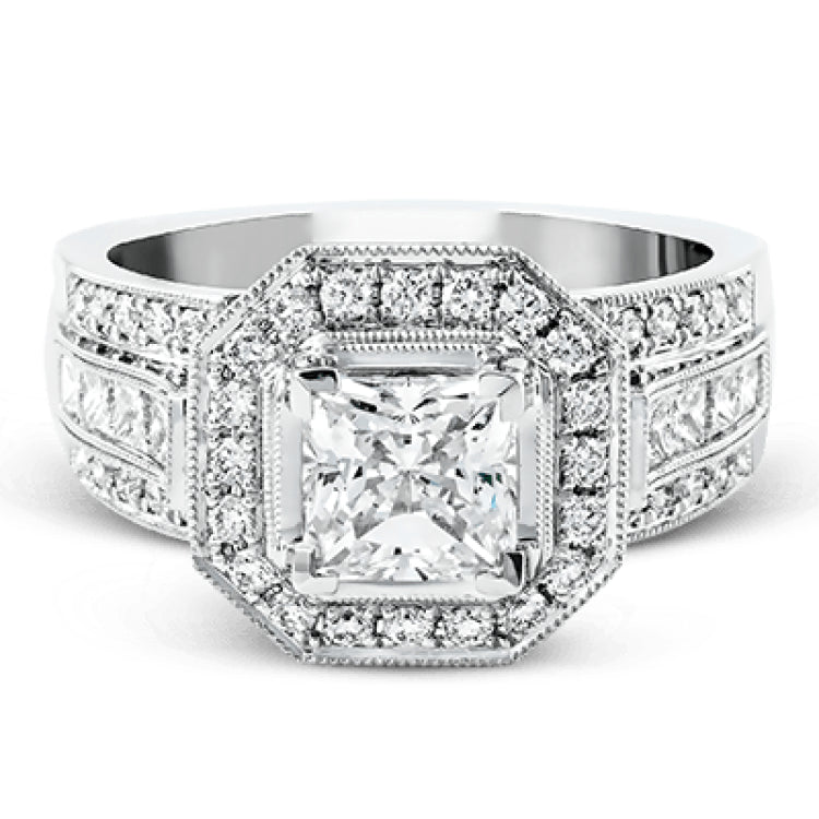The dramatic contemporary design of this white gold ring is highlighted by .59 ctw of round cut white diamonds and .36 ctw princess cut diamonds.