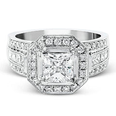 The dramatic contemporary design of this white gold ring is highlighted by .59 ctw of round cut white diamonds and .36 ctw princess cut diamonds.