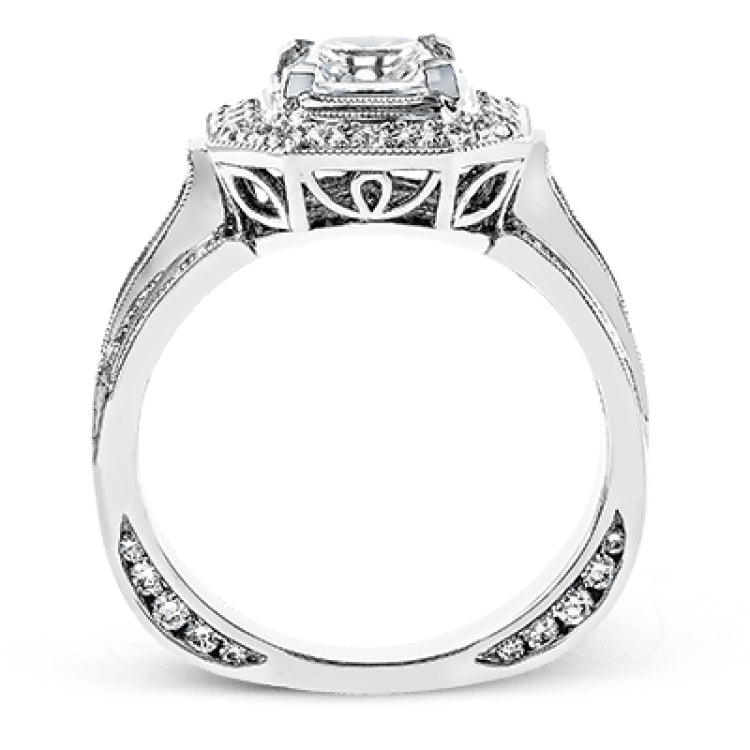 The dramatic contemporary design of this white gold ring is highlighted by .59 ctw of round cut white diamonds and .36 ctw princess cut diamonds.