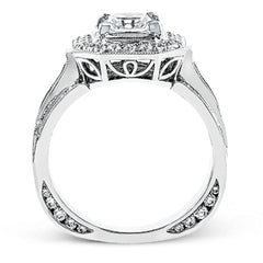 The dramatic contemporary design of this white gold ring is highlighted by .59 ctw of round cut white diamonds and .36 ctw princess cut diamonds.