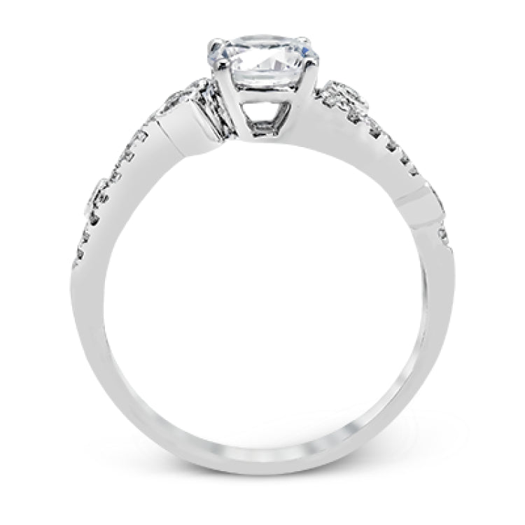 Playful and modern, this white gold wedding set sparkles with .31 ctw of round white diamonds highlighting the center stone.