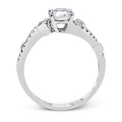 Playful and modern, this white gold wedding set sparkles with .31 ctw of round white diamonds highlighting the center stone.