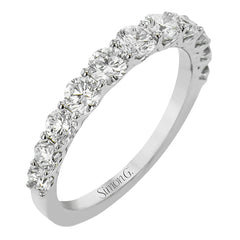 The perfect compliment to your ring, this simple & elegant 18 kt white gold diamond band has 1.10 ctw of round brilliant white diamonds