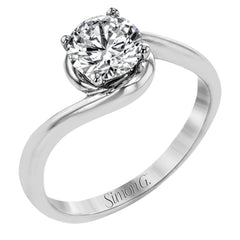This beautiful contemporary design in white gold combines simplicity and a gracefully curved shank to accentuate a single, central stone.