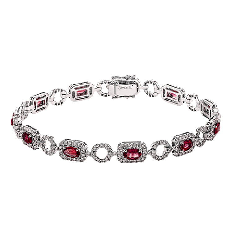 This elegant diamond and gemstone bracelet features 2.21 ctw of ruby and 1.90 ctw of white diamonds, set in 18K white gold