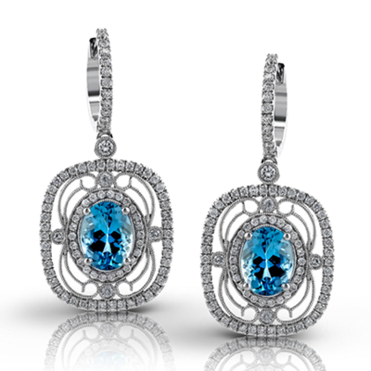 Featuring delicate vintage-inspired styling, these beautiful earrings are set with 1.00 ctw of round cut white diamonds and 2.21 ctw of lovely aquamarines.