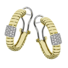 This elegant huggie earring in 18K yellow gold has a ribbed design and accented with 0.24 ctw. of pave set diamonds in white gold, and a lever back closure