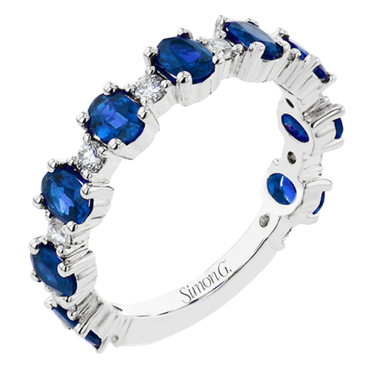 The perfect addition to any stack or bold enough to stand alone, this 18K white gold band showcases 1.69cttw oval sapphires and .35cttw diamonds.