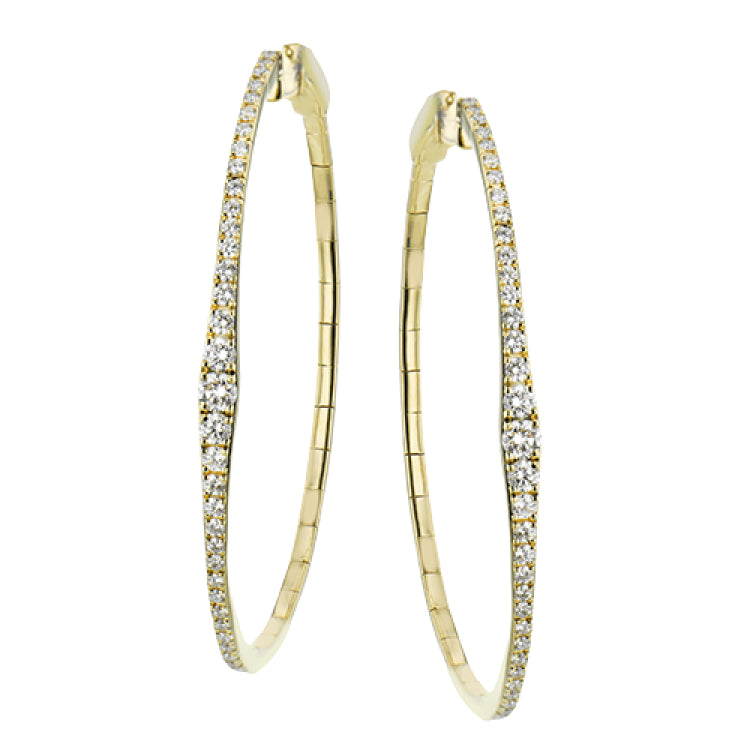 Oval statement hoops are the perfect compliment to day or night attire featuring 1.18cttw diamonds and set in 18K yellow gold.