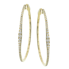Oval statement hoops are the perfect compliment to day or night attire featuring 1.18cttw diamonds and set in 18K yellow gold.
