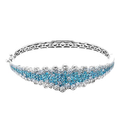 Make a statement with this geometric bangle bracelet featuring 1.91cttw rare pariba tourmaline and 4.21cttw diamonds.