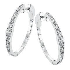 Dress up your classic button down with these 18K white gold hoops featuring .97cttw diamonds.