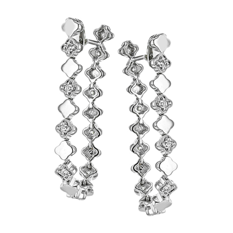 These versatile earrings can be worn in two ways, transforming from a line of diamonds into soft hoops. They're perfect for going from day to night.