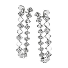 These versatile earrings can be worn in two ways, transforming from a line of diamonds into soft hoops. They're perfect for going from day to night.