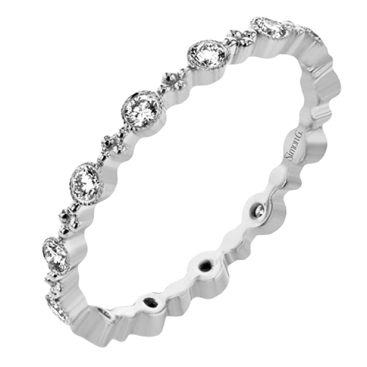 This diamond eternity band from our stackable collection in 14K rose gold, has alternating bezel set diamonds 0.31 ctw. and gold beads.