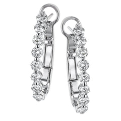 A STAPLE IN ANY JEWELRY WARDROBE, THESE 18k WHITE GOLD HOOPS FEATURING 1CTTW ROUND DIAMONDS  MOVE PERFECTLY FROM DAY TO NIGHT.