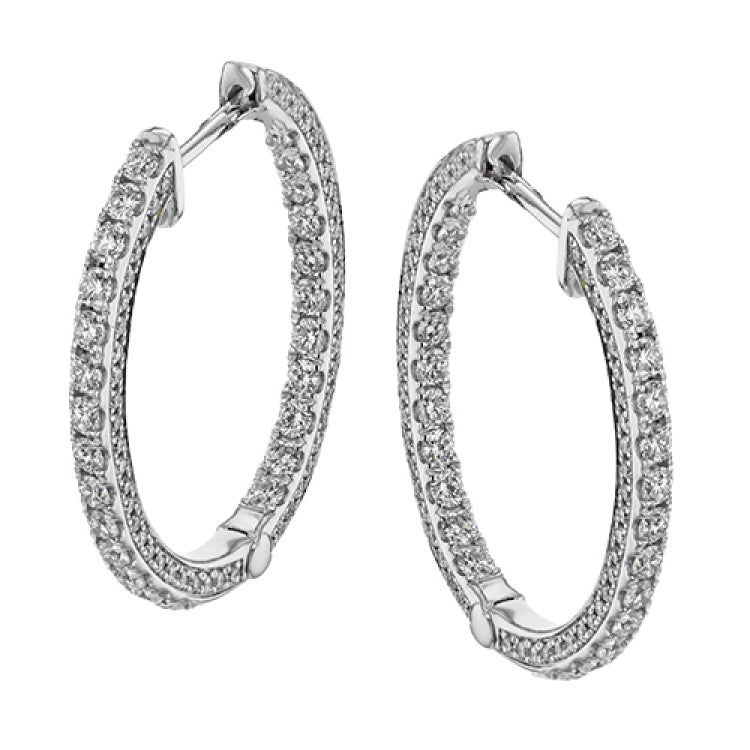 A full 1.00 ctw of diamonds line both in the inside and outside of these remarkable 18k white gold hoop earrings.