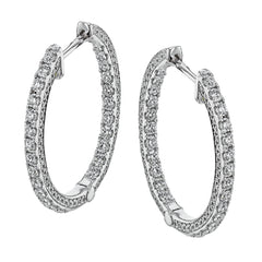 A full 1.00 ctw of diamonds line both in the inside and outside of these remarkable 18k white gold hoop earrings.
