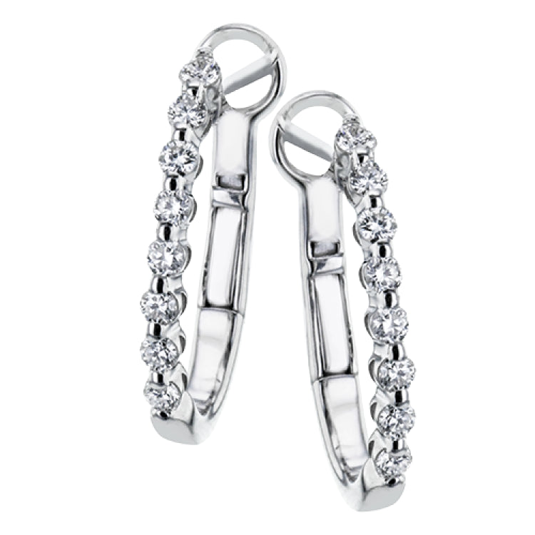 Day to night, the perfect transitional earring, these oval hoops are available in 18K white, yellow and rose gold and feature .32cttw round white diamonds.