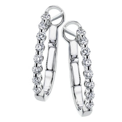 Day to night, the perfect transitional earring, these oval hoops are available in 18K white, yellow and rose gold and feature .32cttw round white diamonds.