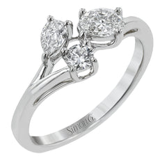Our modern update on the three stone ring, this piece features a round, pear, and oval diamond brought together in a stunning design.