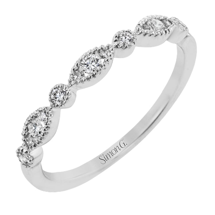 This ring is perfect for stacking with a distinctive design set with  .20 ctw of diamonds.