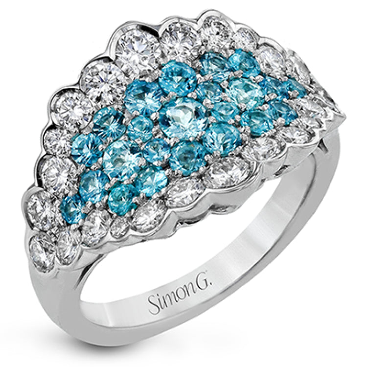 A stunning statement, this right hand ring features .87cttw pariba tourmaline surrounded by 1.35cttw diamonds.
