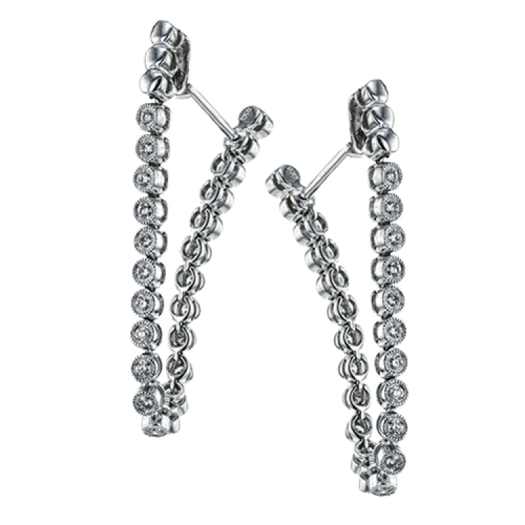 These versatile earrings can be worn in two ways, transforming from a line of diamonds into soft hoops. They're perfect for going from day to night.