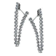 These versatile earrings can be worn in two ways, transforming from a line of diamonds into soft hoops. They're perfect for going from day to night.