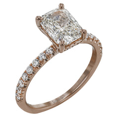This distinctive bridal set design features a double-layer wedding band that fits around the engagement ring. The set contains .77 ctw of white diamonds.