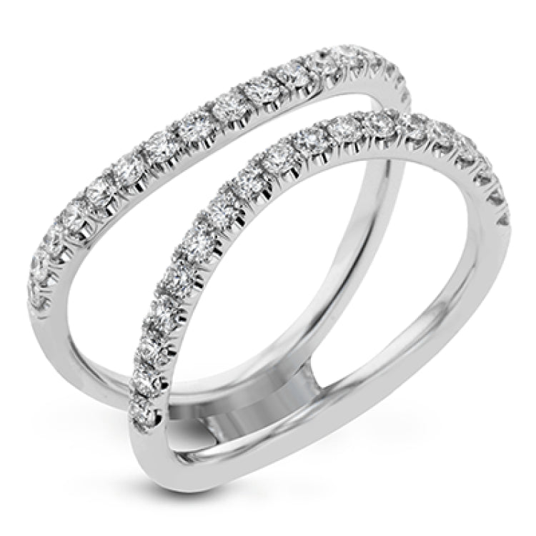 This distinctive bridal set design features a double-layer wedding band that fits around the engagement ring. The set contains .77 ctw of white diamonds.