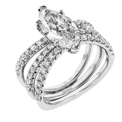 This distinctive bridal set design features a double-layer wedding band that fits around the engagement ring. The set contains .77 ctw of white diamonds.