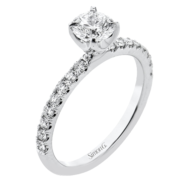 This distinctive bridal set design features a double-layer wedding band that fits around the engagement ring. The set contains .77 ctw of white diamonds.