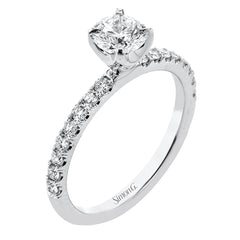 This distinctive bridal set design features a double-layer wedding band that fits around the engagement ring. The set contains .77 ctw of white diamonds.