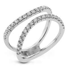 This distinctive bridal set design features a double-layer wedding band that fits around the engagement ring. The set contains .77 ctw of white diamonds.